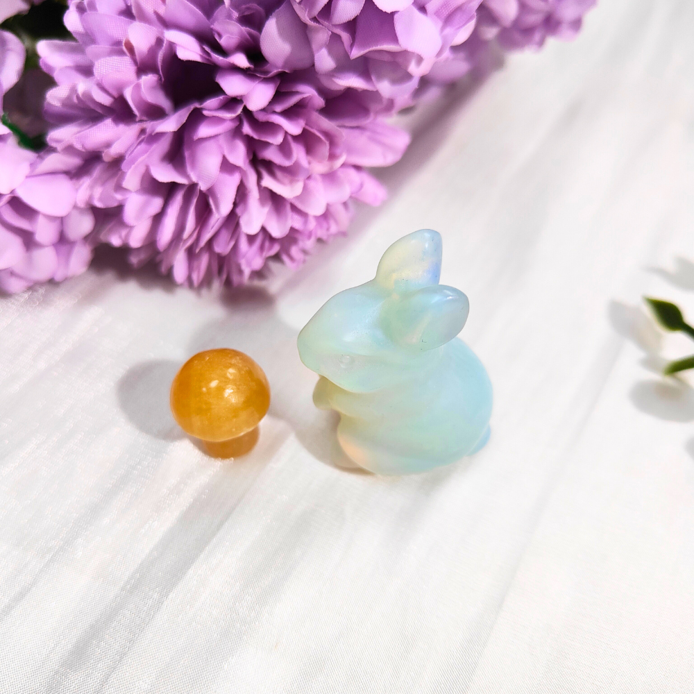 opalite bunny with orange calcite mushroom